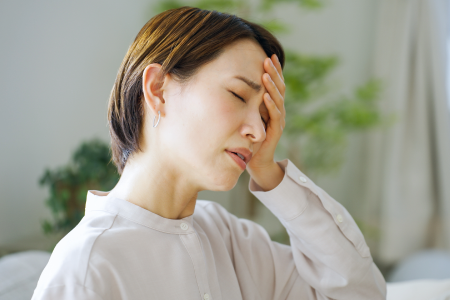 体調不良の女性